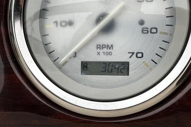 Slide: The Image of Close-up of a 2012 Xcursion X23RF RPM gauge displaying 3042 RPM. - 18