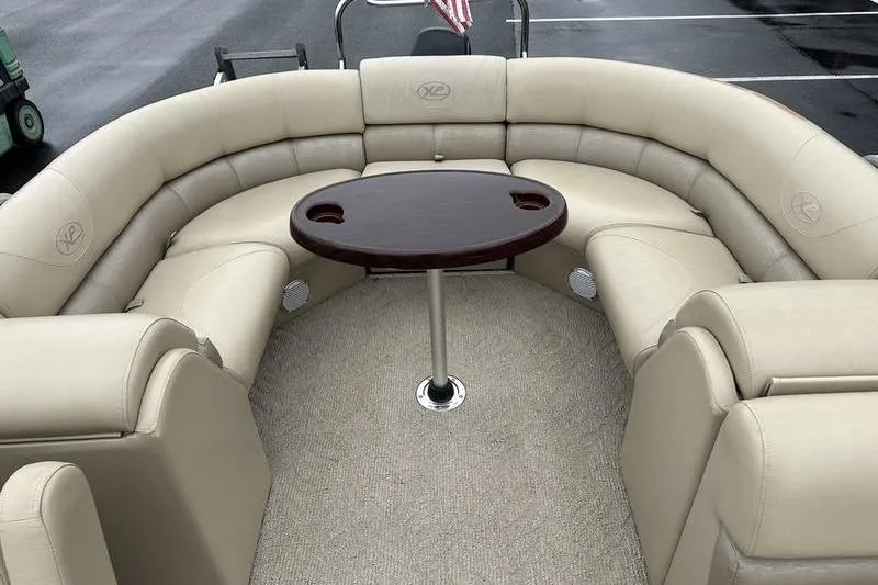 Slide: The Image of Luxurious seating area on 2012 Xcursion X23RF pontoon boat with central table. - 21