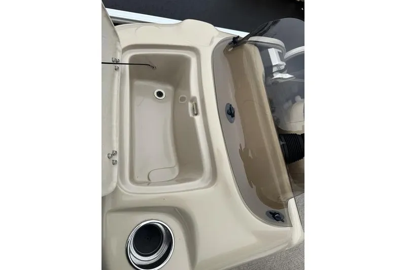 Slide: The Image of 2012 Xcursion X23RF boat console with cup holder and storage compartment. - 25