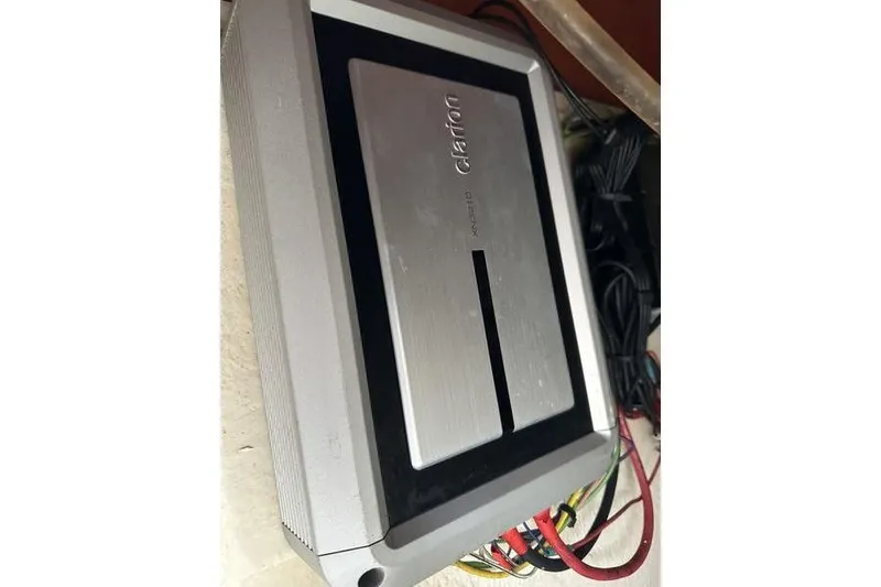 Slide: The Image of Clarion amplifier with wiring, model XH5210, in a 2012 Xcursion X23RF. - 26