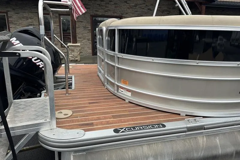 Slide: The Image of 2012 Xcursion X23RF pontoon boat with wooden deck and metal railing. - 27
