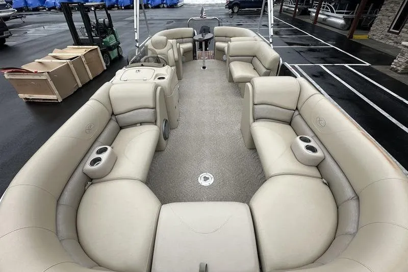 Slide: The Image of 2012 Xcursion X23RF pontoon boat with spacious beige seating and cup holders. - 9