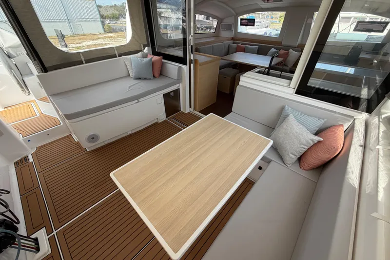 Slide: The Image of Luxurious interior of 2025 C-Catamarans 48 with elegant seating and wooden flooring. - 14