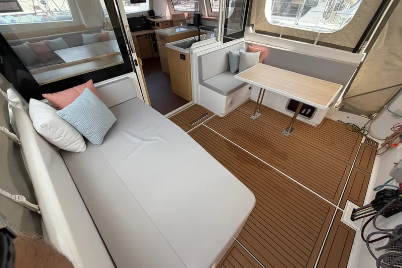 Slide: The Image of Luxurious interior of 2025 C-Catamarans 48 with cozy seating and elegant wood flooring. - 15