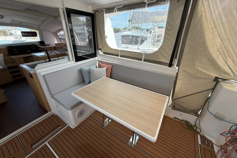 Slide: The Image of 2025 C-Catamarans 48 interior with modern seating and dining area. - 17