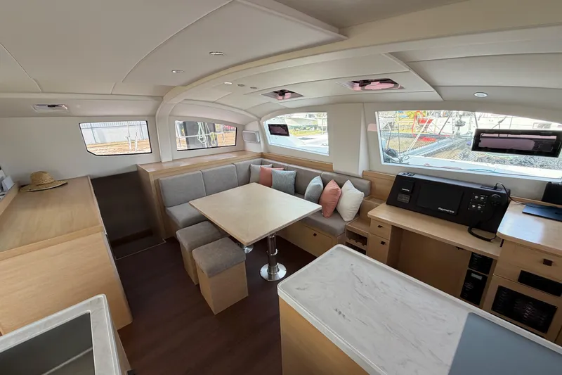 Slide: The Image of Luxurious interior of 2025 C-Catamarans 48 with modern seating and dining area. - 19