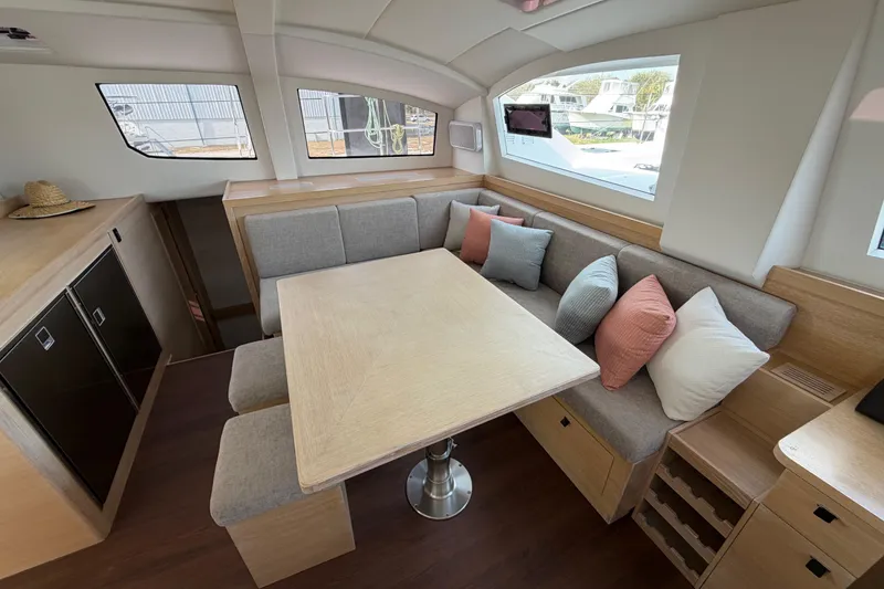 Slide: The Image of Luxurious interior of 2025 C-Catamarans 48 with modern seating and dining area. - 20