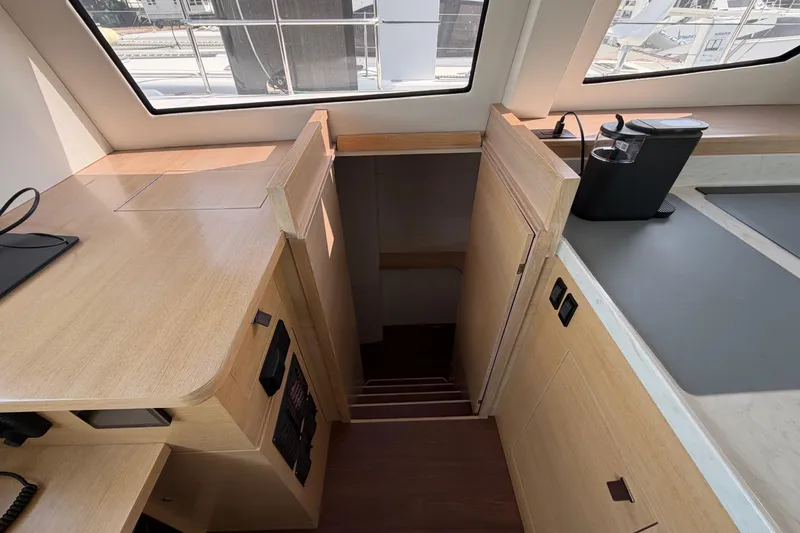 Slide: The Image of Modern interior of 2025 C-Catamarans 48, featuring sleek wood finish and compact design. - 26