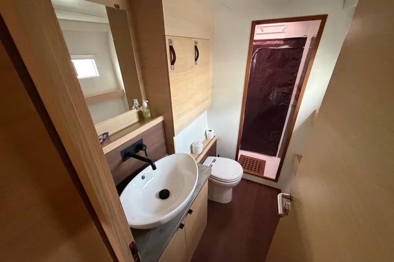 Slide: The Image of Modern bathroom in 2025 C-Catamarans 48, featuring sleek sink, toilet, and shower. - 33