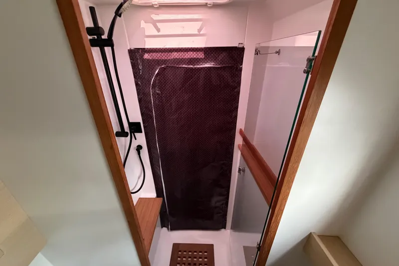 Slide: The Image of Modern shower area in 2025 C-Catamarans 48, featuring sleek design and wooden accents. - 35