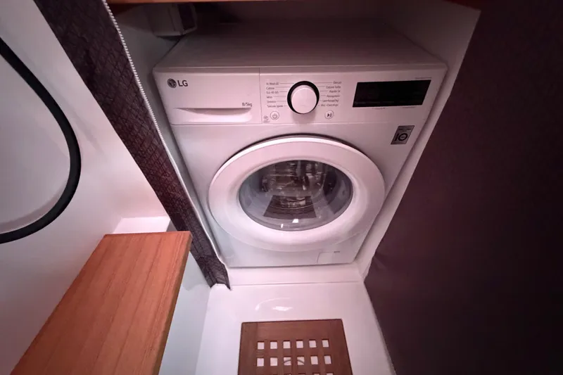 Slide: The Image of Washing machine in 2025 C-Catamarans 48 interior, compact and efficient design. - 36