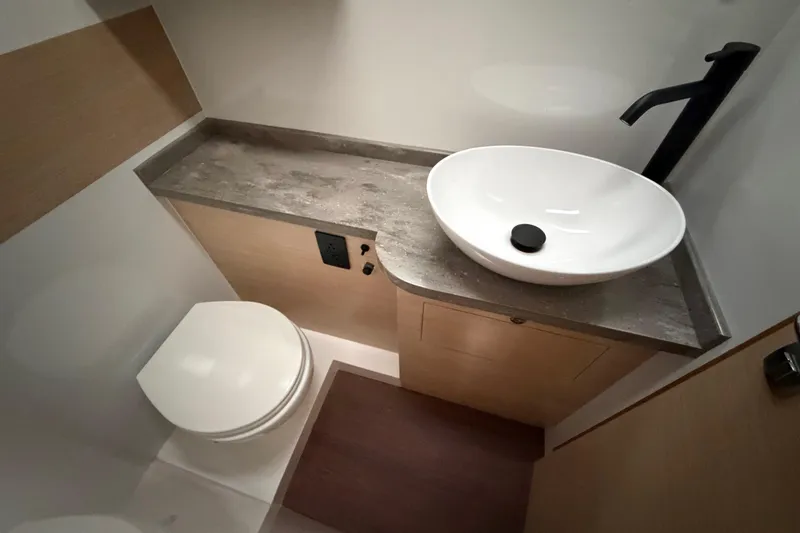 Slide: The Image of Modern bathroom in 2025 C-Catamarans 48, featuring sleek sink and toilet design. - 44
