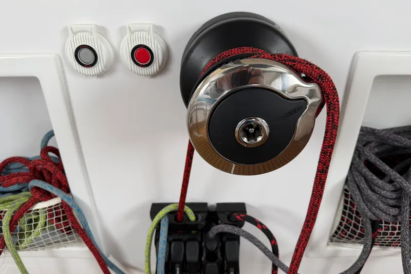 Slide: The Image of C-Catamarans 48 (2025) winch system with ropes and control buttons. - 48