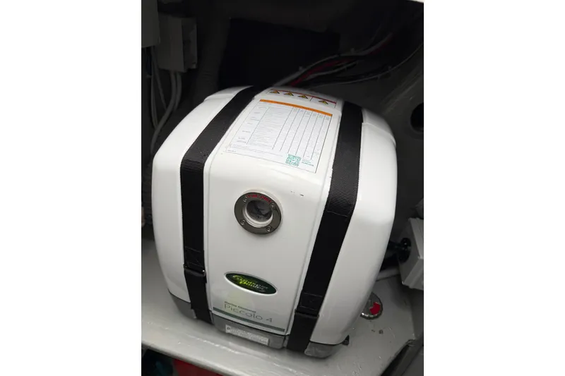 Slide: The Image of Water heater in 2025 C-Catamarans 48, secured with straps in engine compartment. - 52