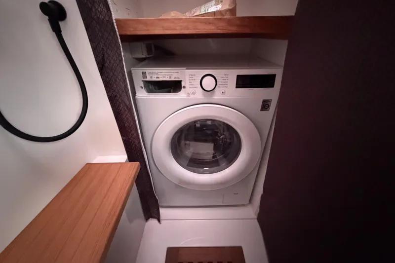 Slide: The Image of Laundry area with washing machine in 2025 C-Catamarans 48 yacht. - 54