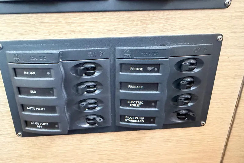 Slide: The Image of Control panel on 2025 C-Catamarans 48, featuring switches for radar, fridge, and more. - 61