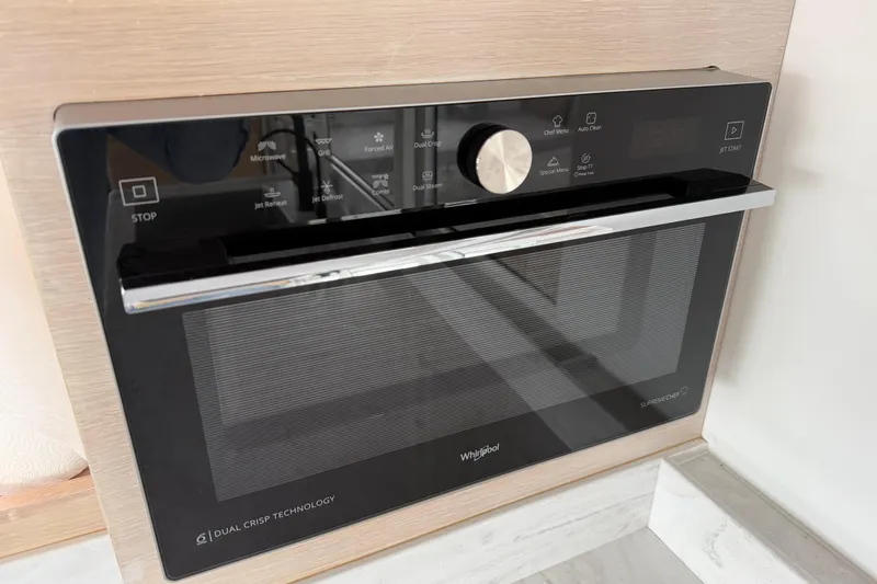 Slide: The Image of Modern Whirlpool microwave with dual crisp technology on C-Catamarans 48, 2025 model. - 65