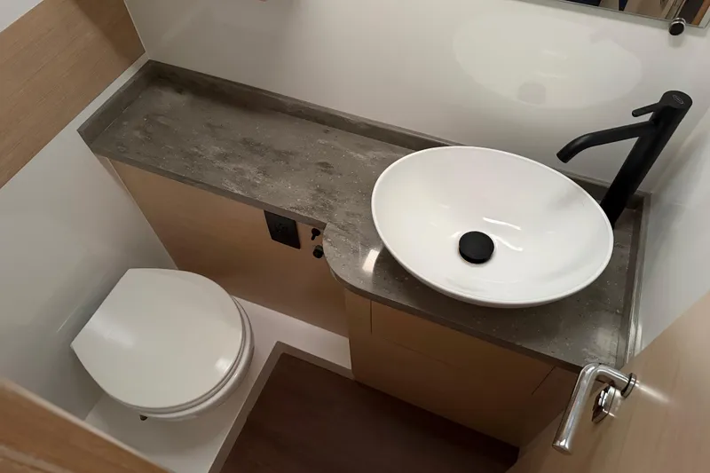 Slide: The Image of Modern bathroom in 2025 C-Catamarans 48, featuring sleek sink and toilet design. - 71