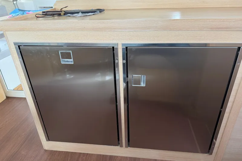 Slide: The Image of Stainless steel fridge doors on 2025 C-Catamarans 48 yacht interior. - 72