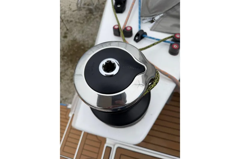 Slide: The Image of Winch on 2025 C-Catamarans 48 deck, featuring ropes and pulleys. - 82