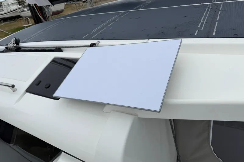 Slide: The Image of 2025 C-Catamarans 48 with solar panels and a mounted satellite dish on deck. - 93