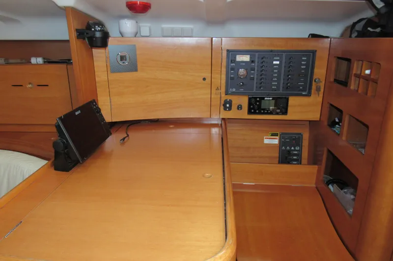 Slide: The Image of Interior of 2002 Beneteau First 40.7 yacht with navigation equipment and control panel. - 13