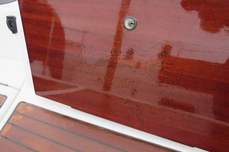 Slide: The Image of Polished wooden panel with engraved design on a 2002 Beneteau First 40.7 yacht. - 19