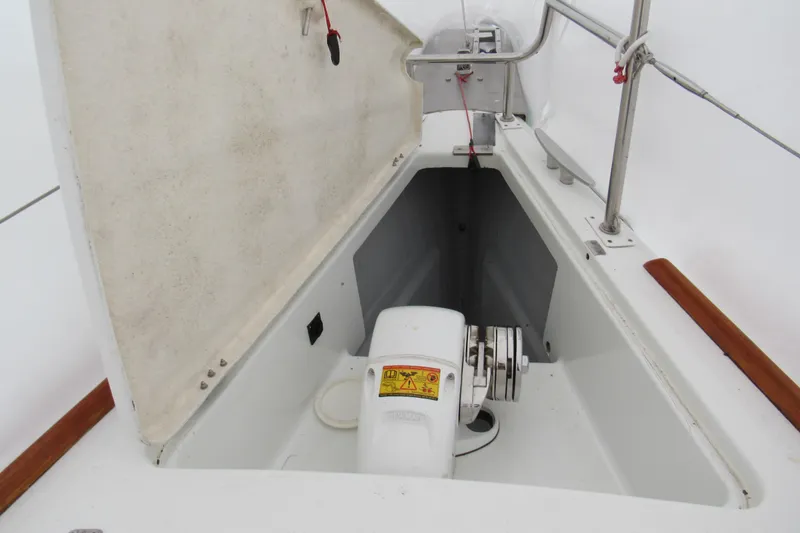 Slide: The Image of Open anchor locker of 2002 Beneteau First 40.7 sailboat, showcasing winch and storage space. - 26