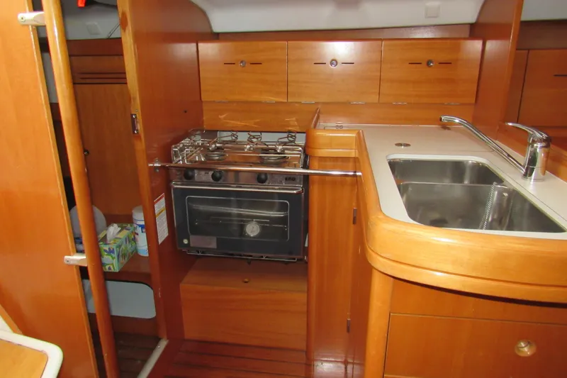 Slide: The Image of Interior of 2002 Beneteau First 40.7 yacht kitchen with stove and sink. - 3