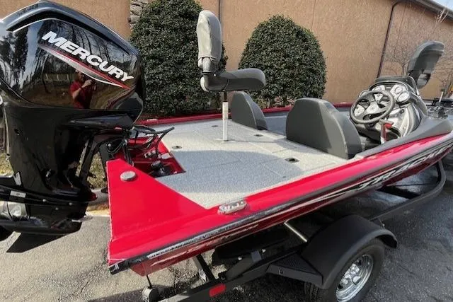 Slide: The Image of 2024 Tracker Pro Team 175 TXW boat with Mercury engine, red exterior, and dual seating. - 5