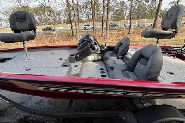 Slide: The Image of 2024 Tracker Pro Team 175 TXW fishing boat with red exterior and comfortable seating. - 9