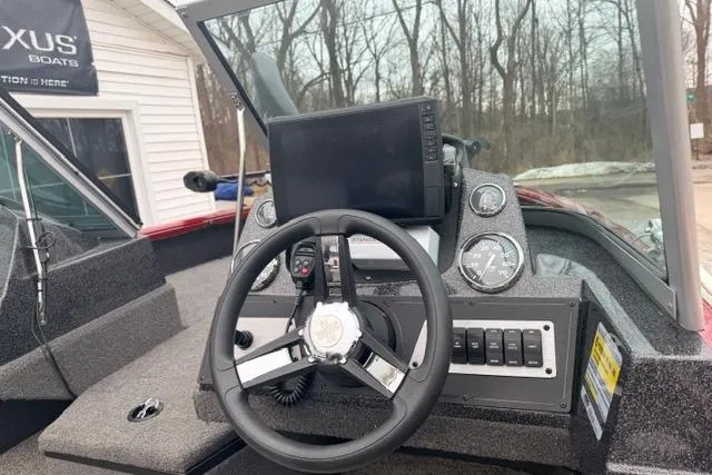 Slide: The Image of 2017 Ranger VS1780 boat dashboard with steering wheel and navigation system. - 4