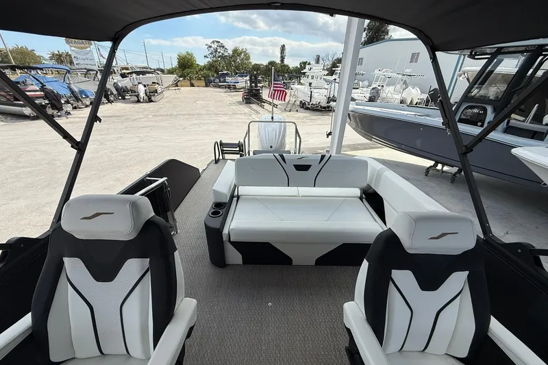 Slide: The Image of Interior view of 2026 Evotti 725CS boat with modern seating and canopy. - 12