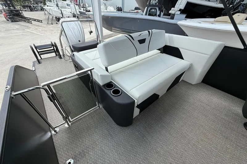 Slide: The Image of 2026 Evotti 725CS boat interior with white seating and cup holders. - 13