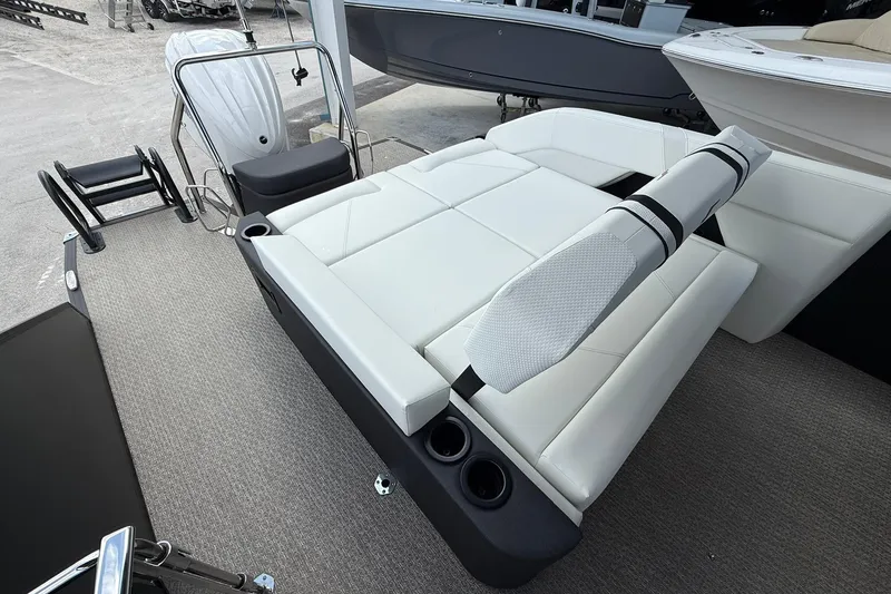 Slide: The Image of 2026 Evotti 725CS boat interior with white seating and cup holders. - 14