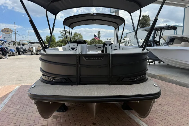Slide: The Image of 2026 Evotti 725CS pontoon boat with canopy, displayed at a marina. - 3