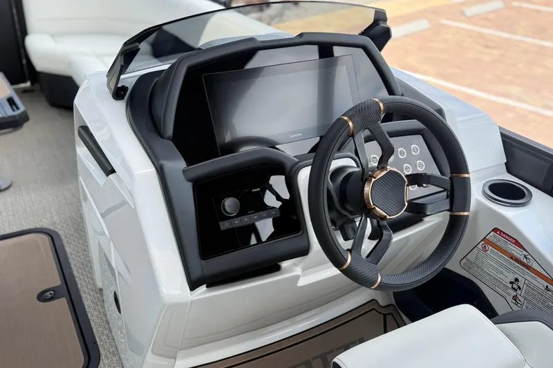 Slide: The Image of 2026 Evotti 725CS boat dashboard with modern steering wheel and touchscreen controls. - 9