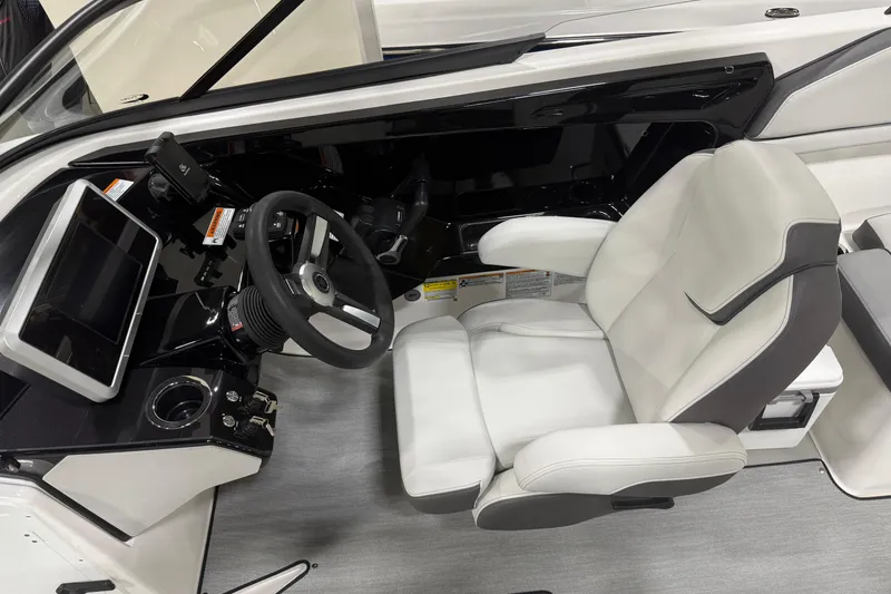 Slide: The Image of 2026 Yamaha Boats AR250 cockpit with modern steering, touchscreen, and comfortable seating. - 3