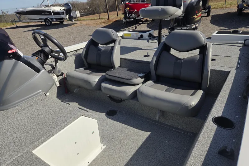 Slide: The Image of 2020 G3 Sportsman 1810 boat interior with dual gray seats and steering wheel. - 16