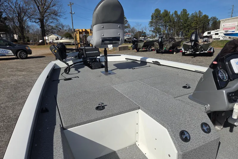 Slide: The Image of 2020 G3 Sportsman 1810 boat with advanced navigation equipment, parked outdoors. - 17