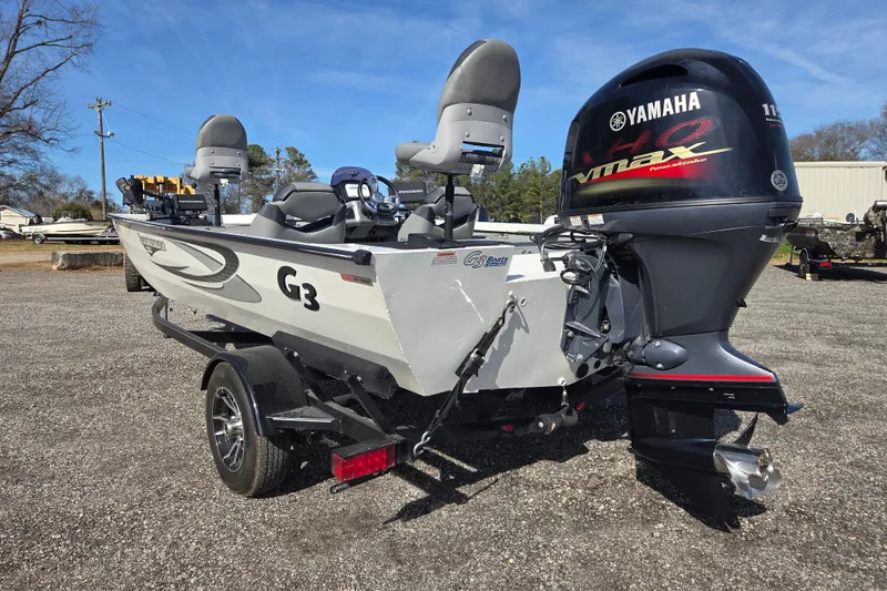 Slide: The Image of 2020 G3 Sportsman 1810 boat with Yamaha VMAX engine, parked outdoors. - 6