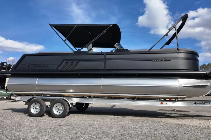The Image of 2026 Viaggio Diamante D24U pontoon boat on trailer under blue sky. - 0
