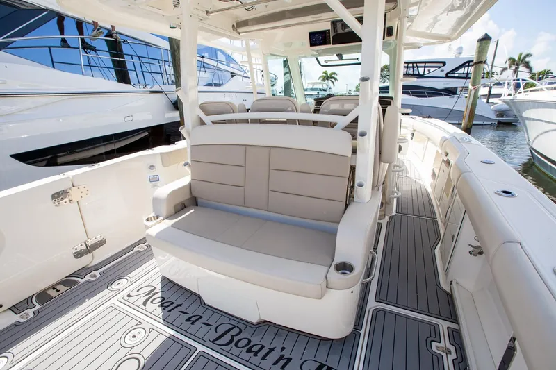 Slide: The Image of 2019 Boston Whaler 380 Outrage interior with seating and deck details. - 13