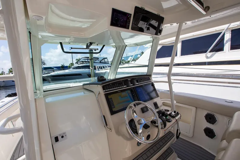 Slide: The Image of 2019 Boston Whaler 380 Outrage helm with advanced navigation systems and luxurious design. - 3