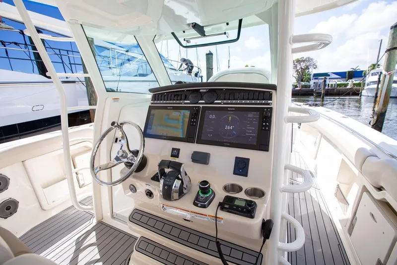 Slide: The Image of 2019 Boston Whaler 380 Outrage helm with advanced navigation and control systems. - 4