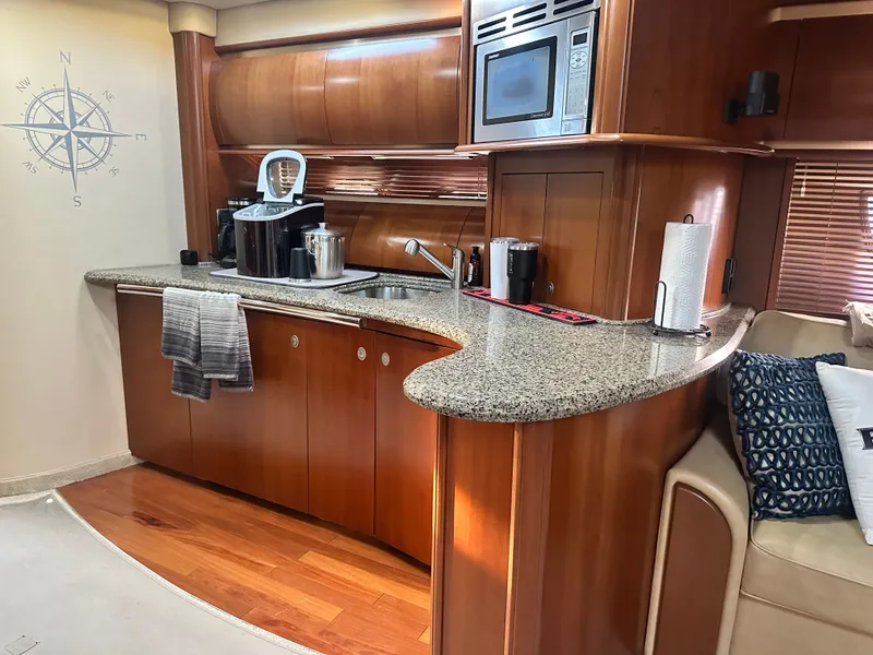 Slide: The Image of Luxurious kitchen in a 2006 Sea Ray 52 Sundancer yacht. - 11