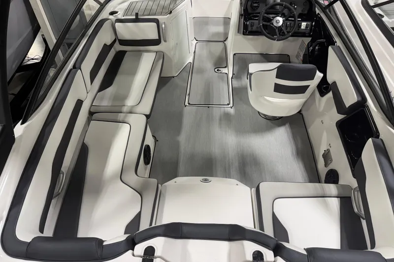 Slide: The Image of 2026 Yamaha Boats AR195 interior with sleek seating and modern steering console. - 2
