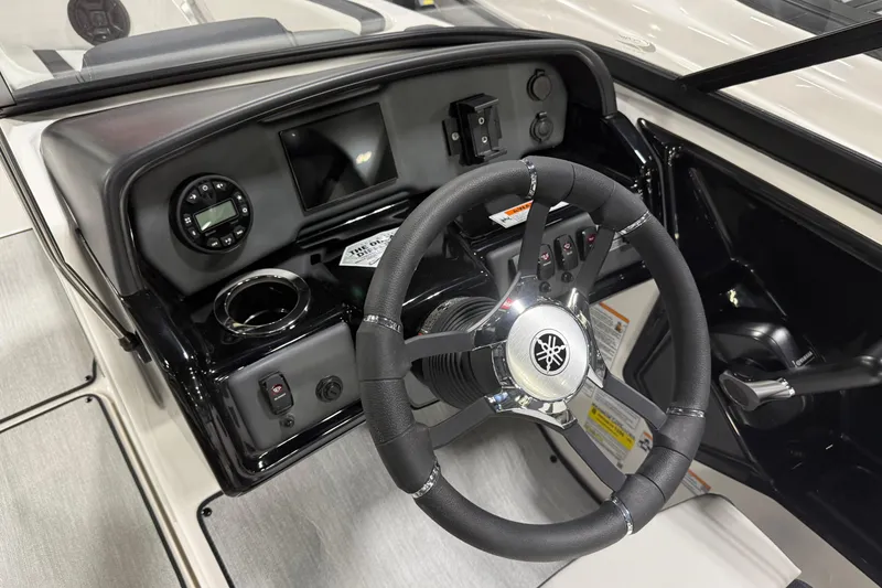 Slide: The Image of 2026 Yamaha Boats AR195 dashboard with steering wheel and control panel. - 4