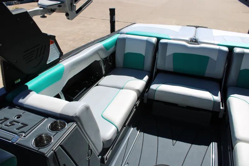 Slide: The Image of Interior of 2020 Malibu Wakesetter 25 LSV boat with teal and gray seating. - 11