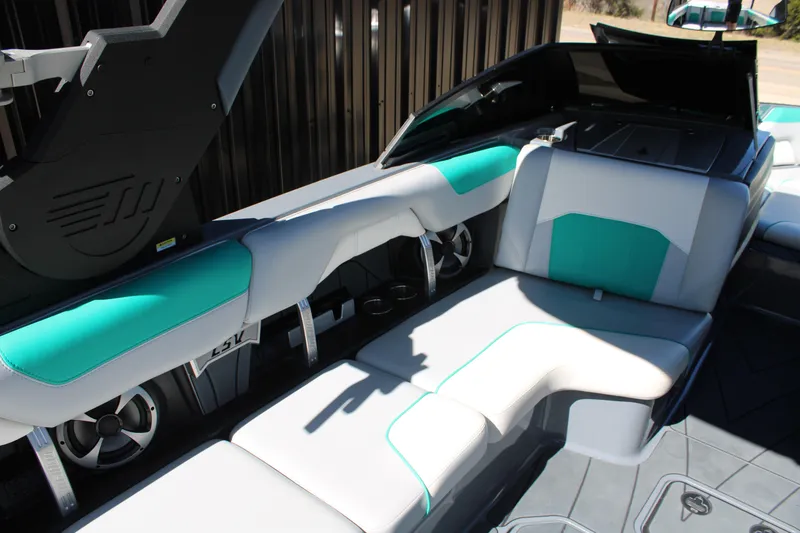 Slide: The Image of 2020 Malibu Wakesetter 25 LSV interior with teal and white seating, showcasing luxury design. - 12